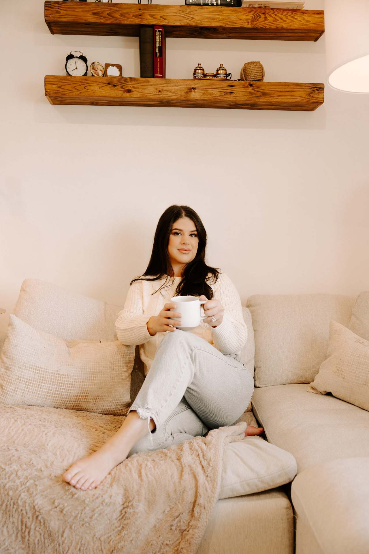 Adrienne with a morning coffee on the sofa